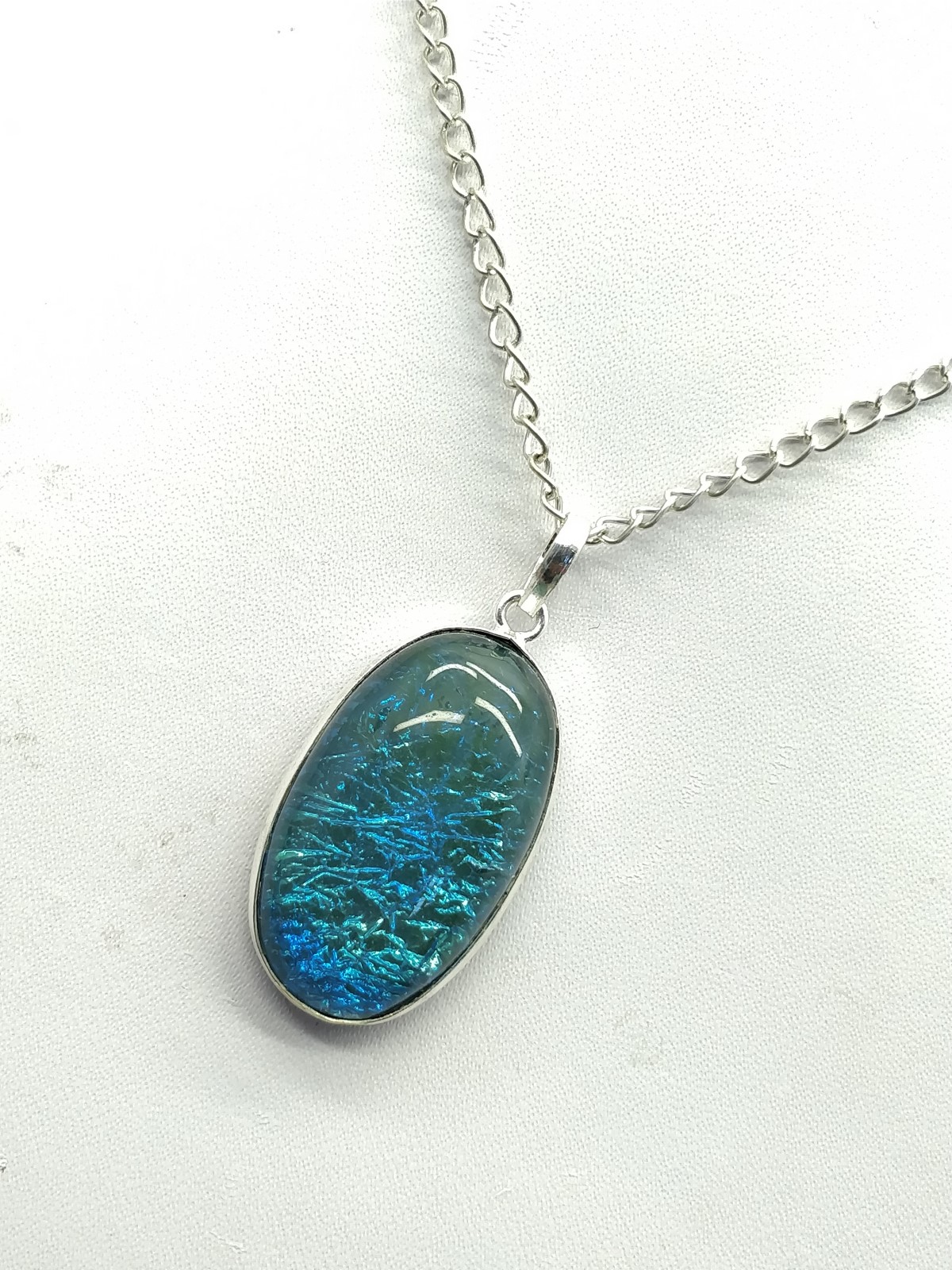 Blue Fire Opal Pendant 40x18x8 mm, Oval & Smooth wt. in 36 Ct. MG209