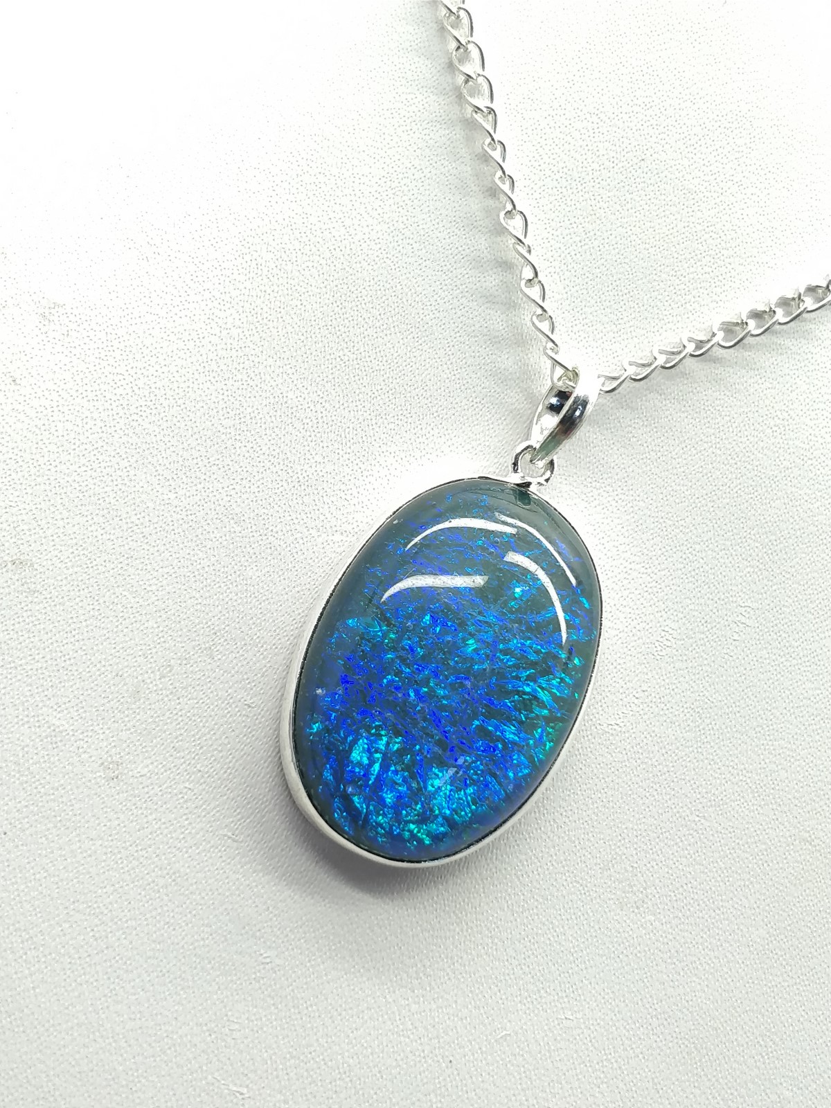 Blue Fire Opal Pendant 34x21x8 mm, Oval & Smooth wt. in 45 Ct. MG14